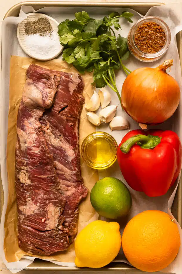Photo of all the ingredients for skirt steak fajita recipe on a tray.
