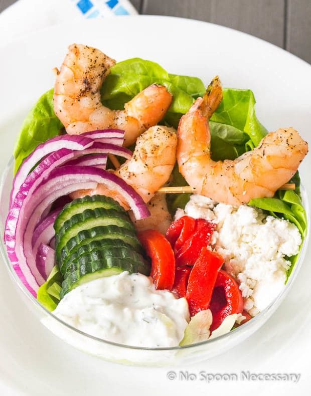 shrimp Greek salad in a clear bowl