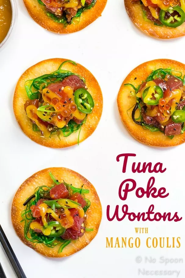 Overhead shot of Tuna Poke Wontons with Mango Coulis Sauce on a white surface with the words "tuna poke wontons with mango coulis" written on the photo in the bottom right corner.