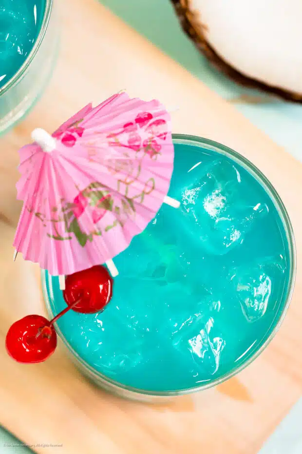 Overhead photo of a blue drink mixed with malibu rum.