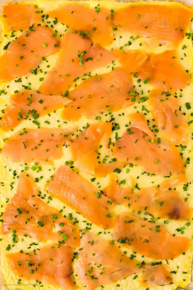 Close-up photo of salmon omelet before being rolled.