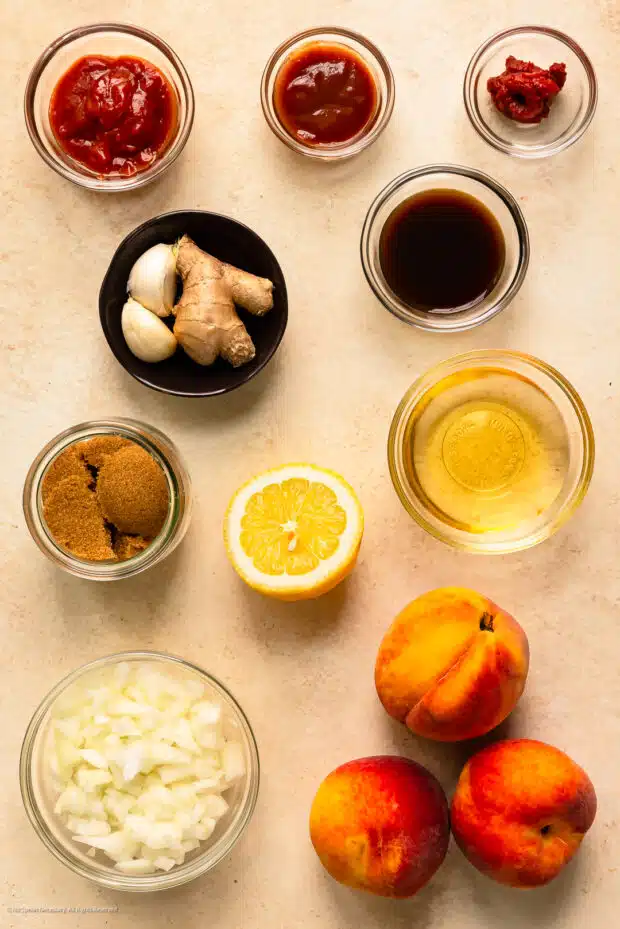 Overhead photo of the eleven ingredients for peach BBQ sauce recipe.