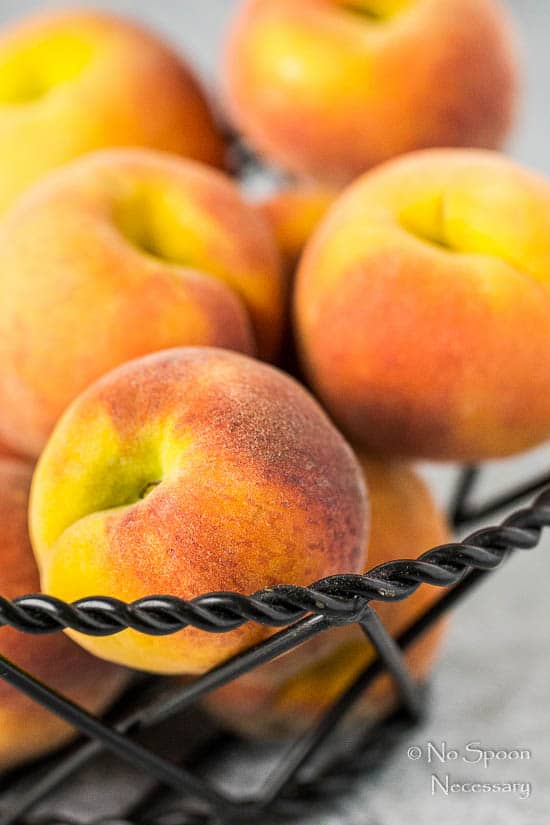 closeup of a basket of ripe peaches for grilled ribs