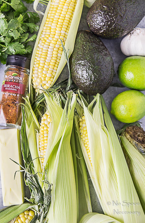 Overhead shot of all the ingredients needed to make Grilled Corn with Avocado Sriracha Butter recipe.