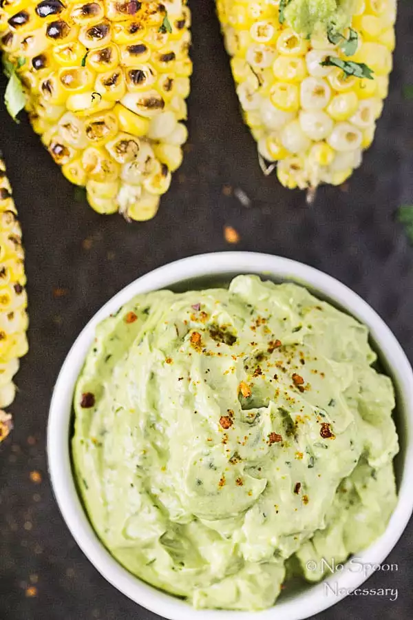 Overhead, up close shot of Avocado Sriracha Butter for the recipe Grilled Corn with Avocado Sriracha Butter.