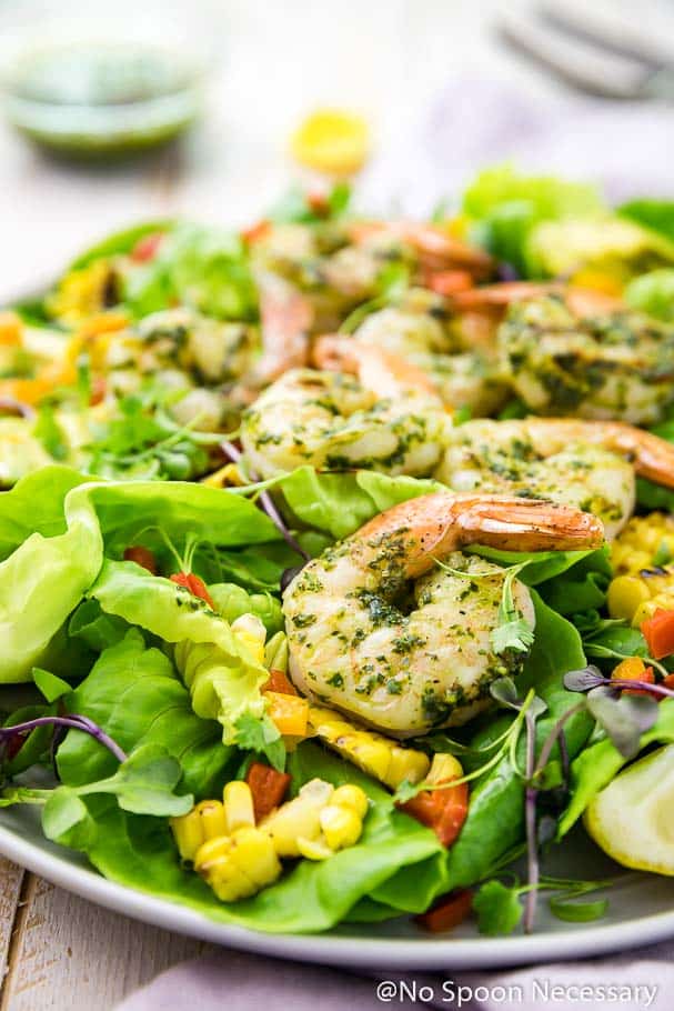 green salad with grilled shrimp, corn, and peppers