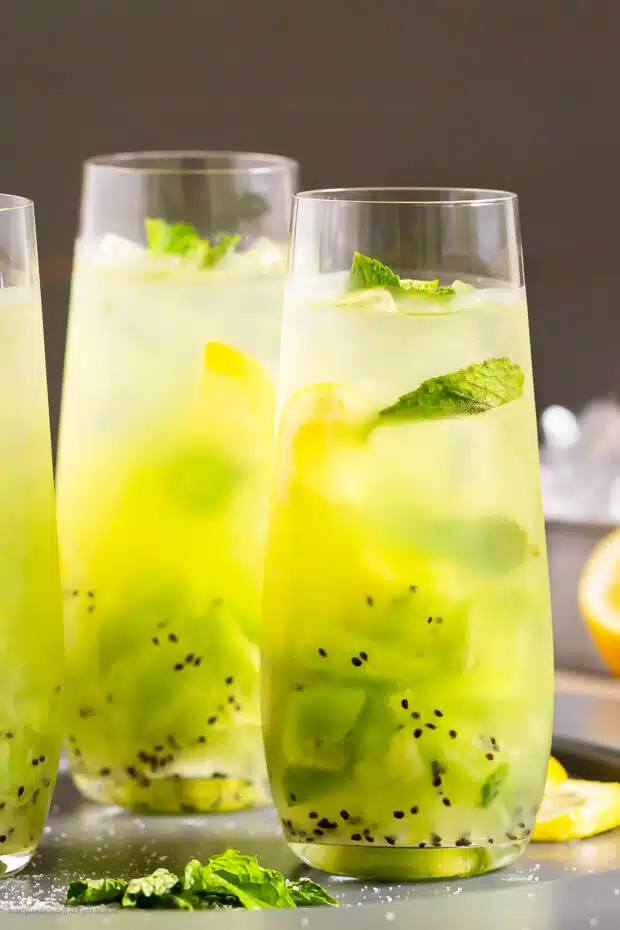 Straight on photo of a two kiwifruit cocktails with tequila.