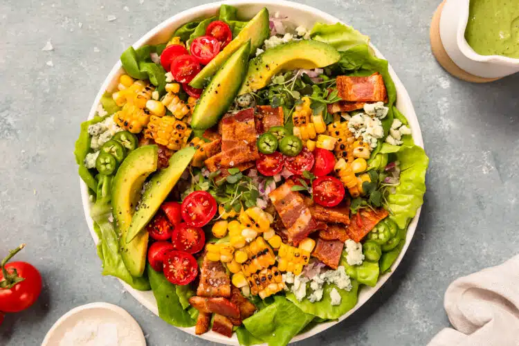 Overhead photo of the best blt salad recipe in a white bowl.