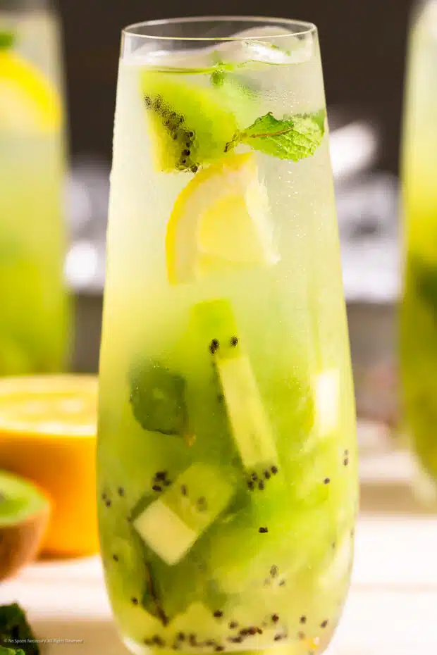 Close-up photo of a fruity drink with tequilla and kiwis.