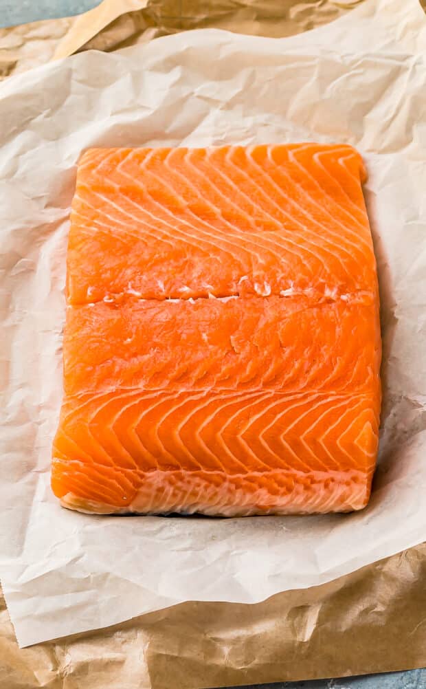 Straight on photo of a raw filet of salmon.
