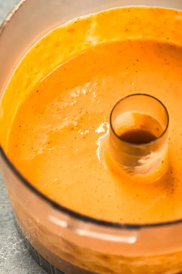 Close-up photo of spicy chipotle sauce for fish and rice bowls.