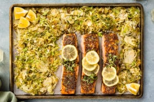 Overhead photo of honey dijon salmon and brussels sprouts on a sheet pan.