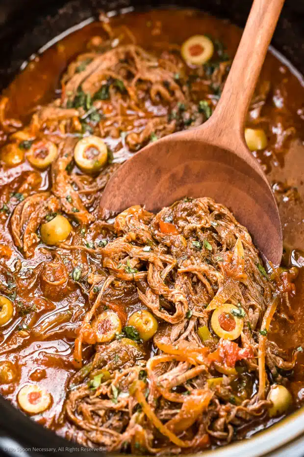 Close-up photo of the juicy, shredded beef texture of cuban ropa vieja recipes.