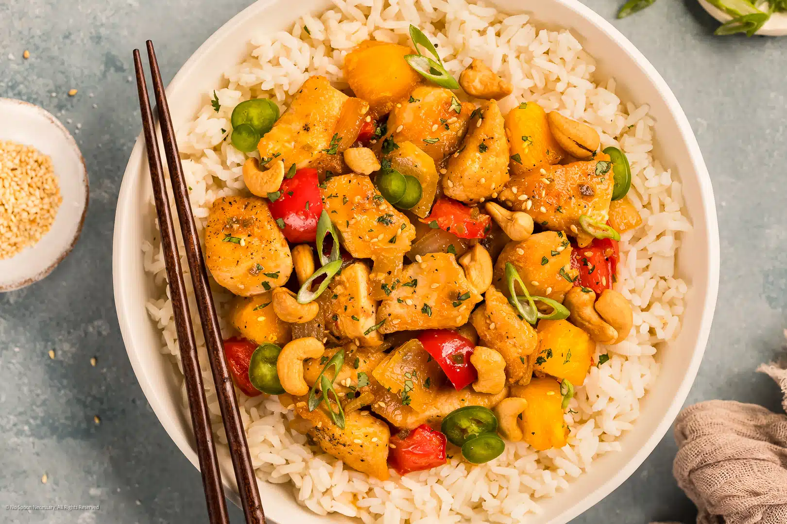 Overhead photo of apricot chicken stir fry with bell peppers, onions, and pineapple chunks.