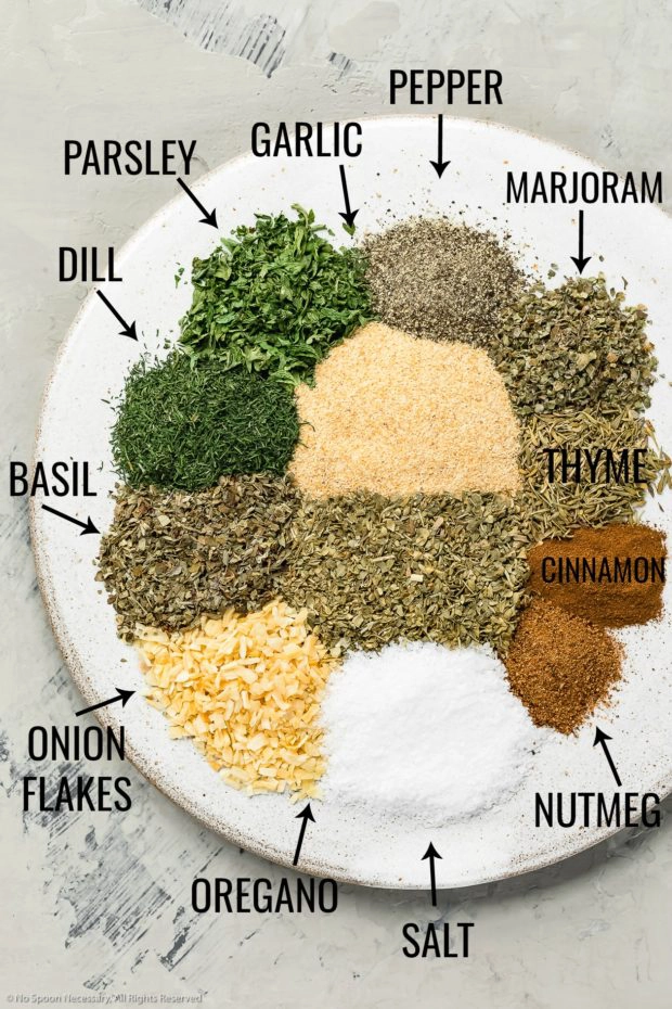Overhead shot of all the ingredients needed to make Homemade Greek Seasoning Recipe with the name of each ingredient written out next to it.