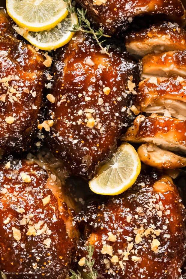 Close-up photo of a perfectly cooked fig jam chicken thigh.