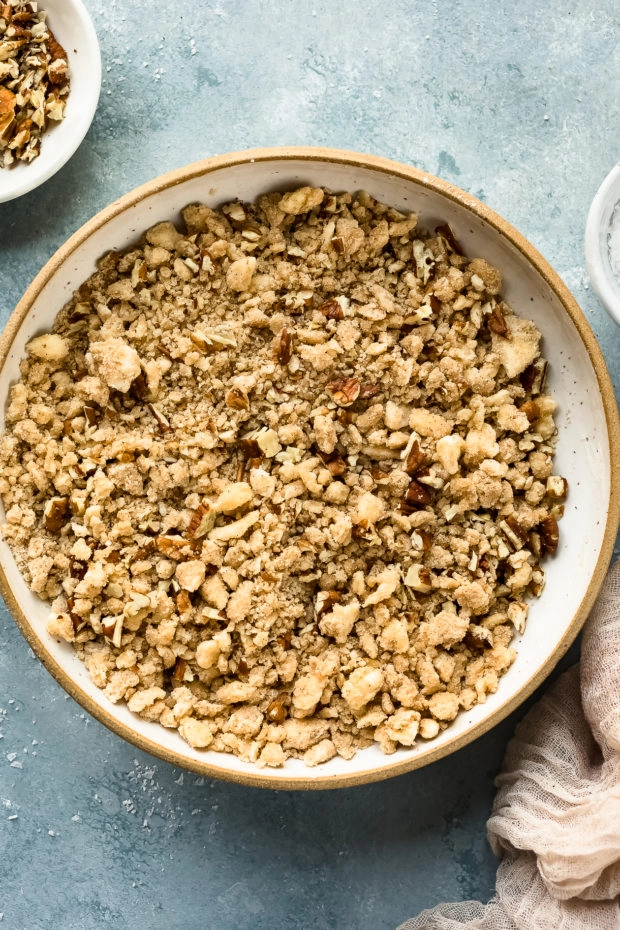 Overhead photo of brown sugar pecan streusel topping in a large mixing bowl. 
