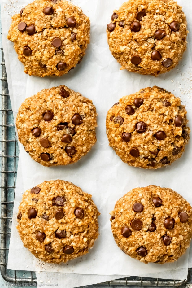 Overhead, close-up photo of healthy breakfast cookies on a parchment paper lined wire rack.