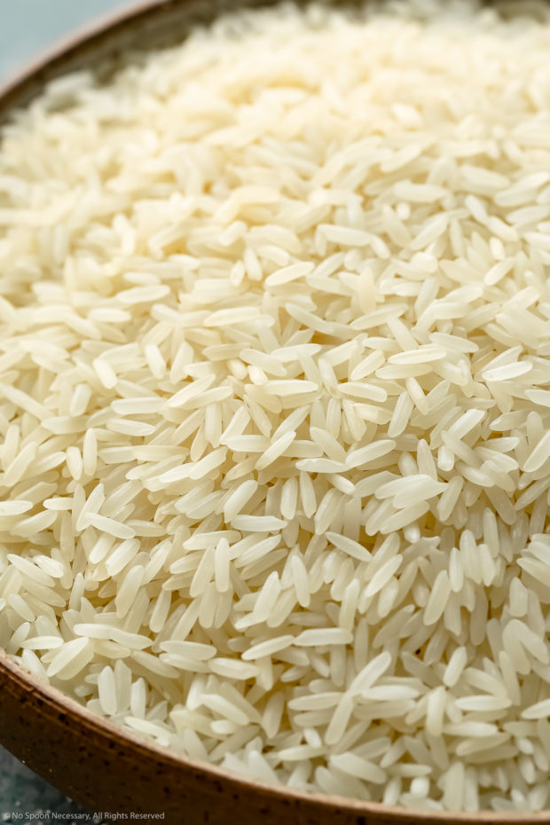 Angled, up-close photo of uncooked Jasmine rice - photo of the second main ingredient in the recipe.