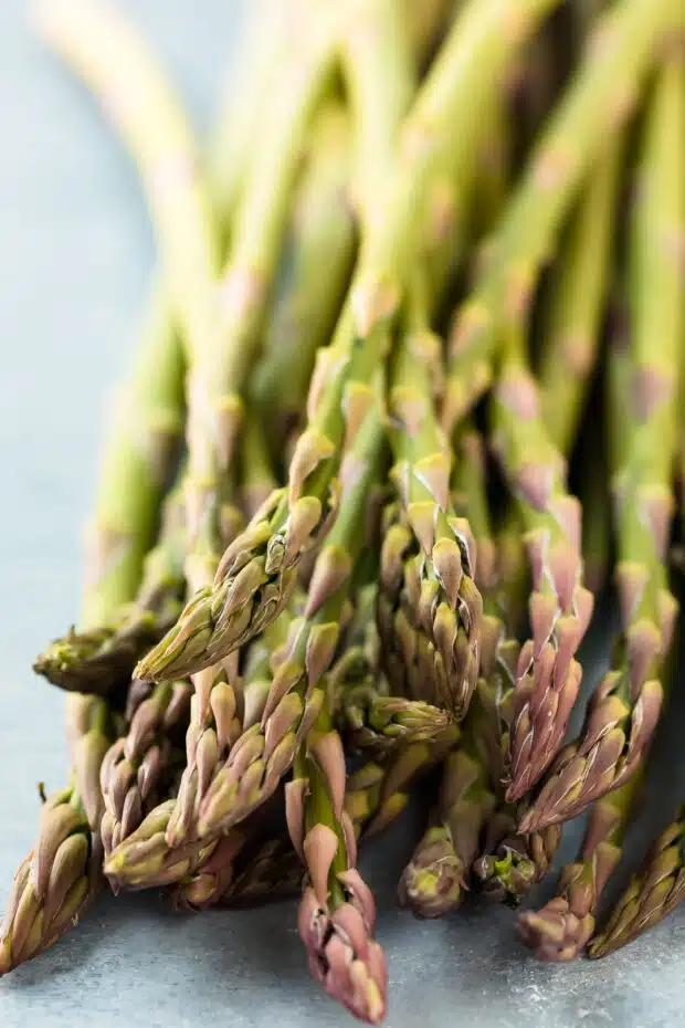 Close-up photo of raw asparagus spears (before baking).