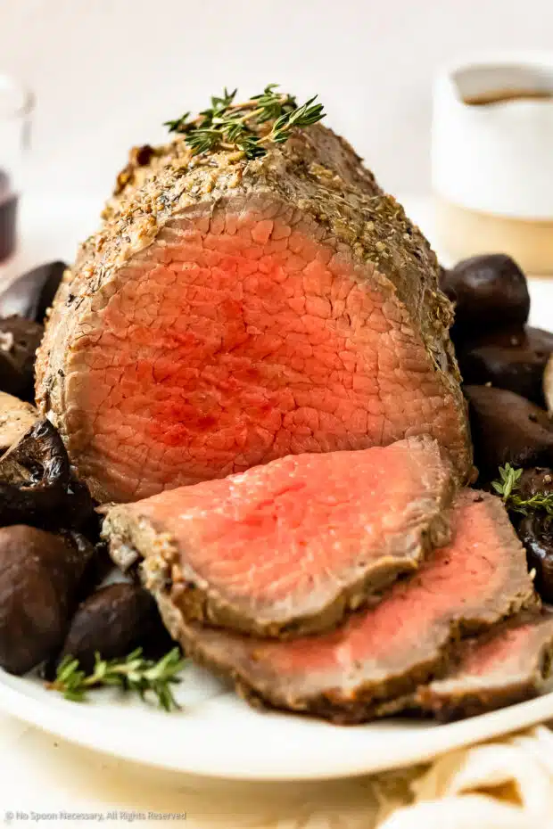 Close-up photo of the medium rare roast eye of round beef.
