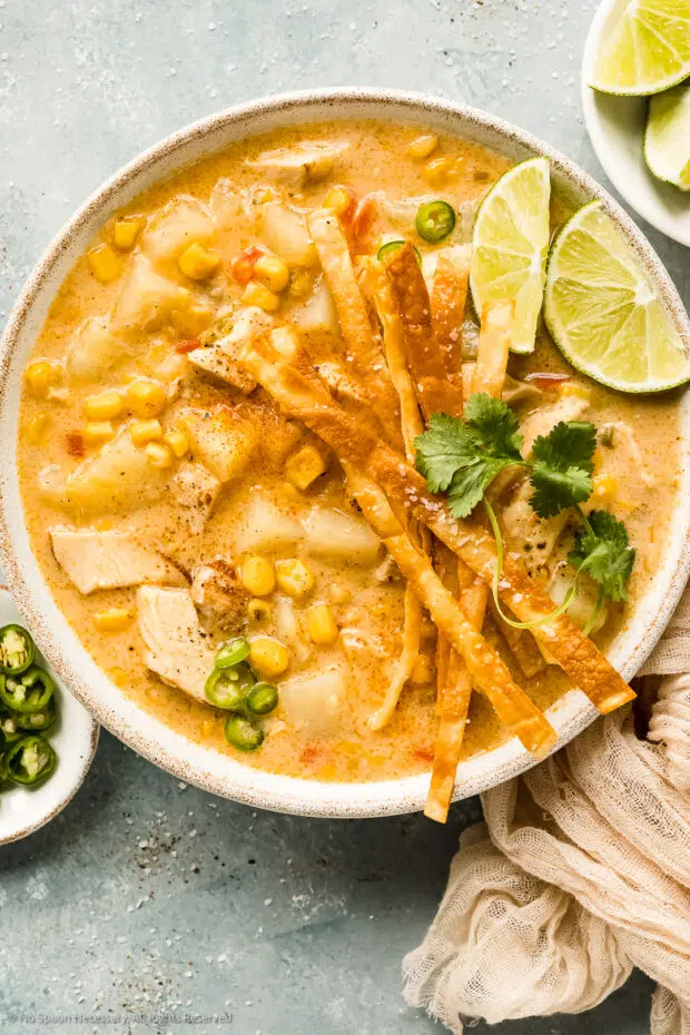 Overhead photo of prepared recipe for chicken corn chowder in a white soup bowl.