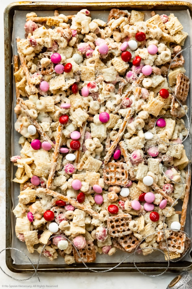 Overhead photo of Sweet Chex Mix on a parchment-paper lined sheet pan.