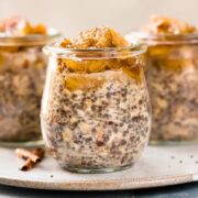 Straight on photo of three chia overnight oats with banana topping in glass jars.