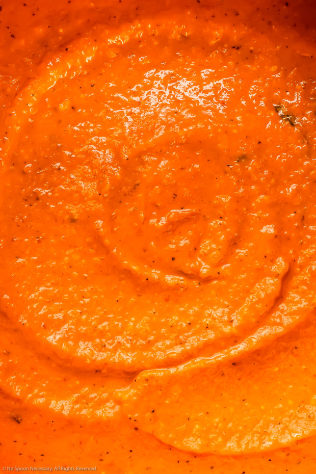 Overhead, close-up photo of red pepper pasta sauce - photo showcasing the creamy, thick texture of the sauce