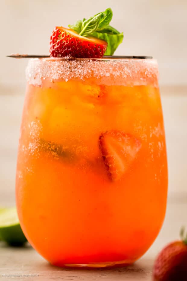 Close-up photo of a basil strawberry cocktail.