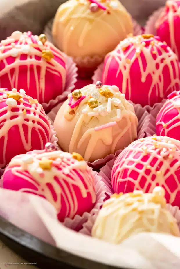 Close-up photo of pink and white decorating ideas for cake pops without sticks.
