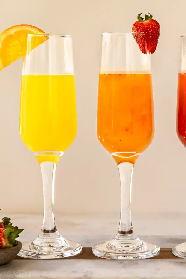 Straight on photo of two flavored mimosas.