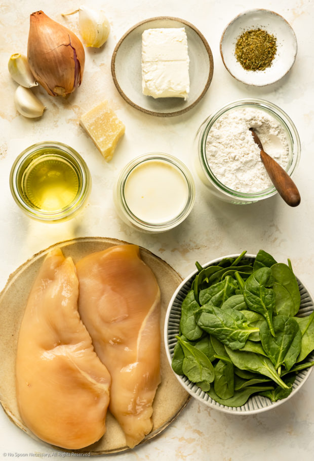 Overhead photo of all the ingredients needed to make the recipe for chicken Florentine at home.
