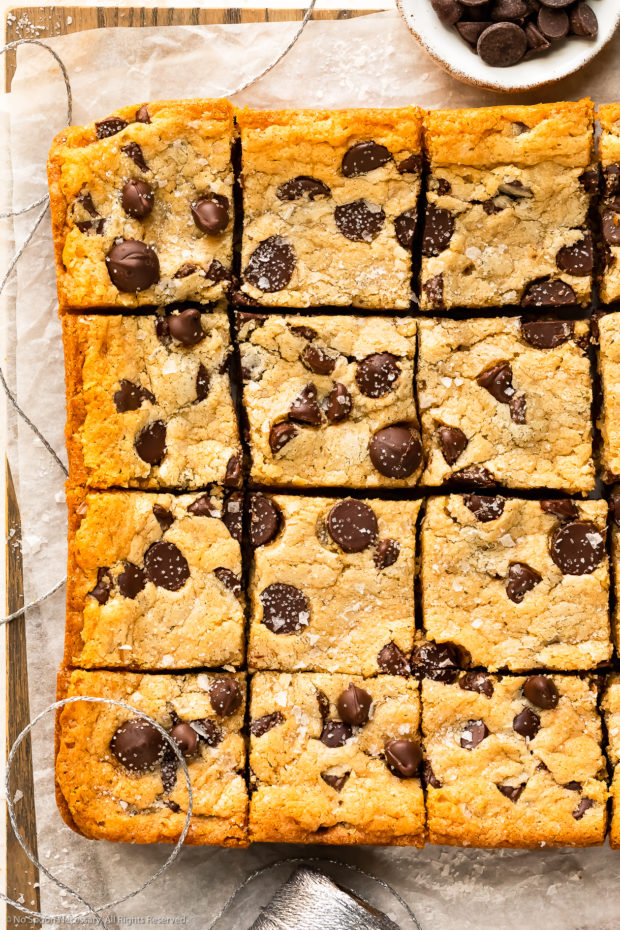 Overhead photo of Chocolate Chip Cookie Bars on a wood serving tray.