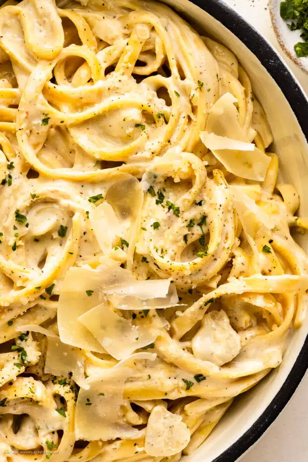 Close-up photo of philadephia cheese sauce coating pasta noodles.