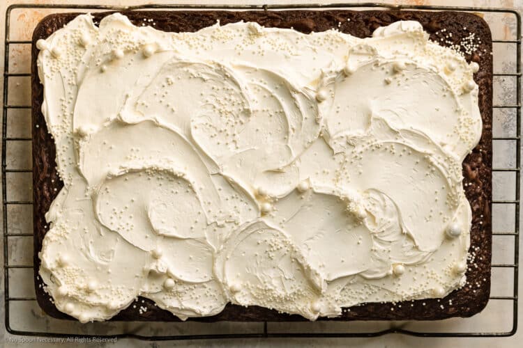 Overhead photo of cool whip frosting on a chocolate cake.