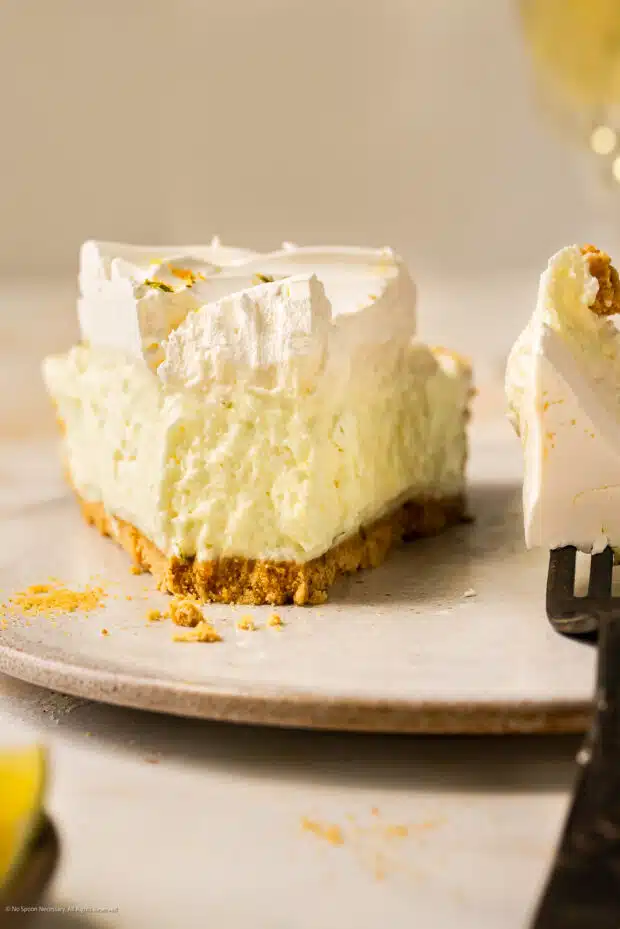 Straight on photo showcasing the creamy texture of a slice of no bake key lime dessert.