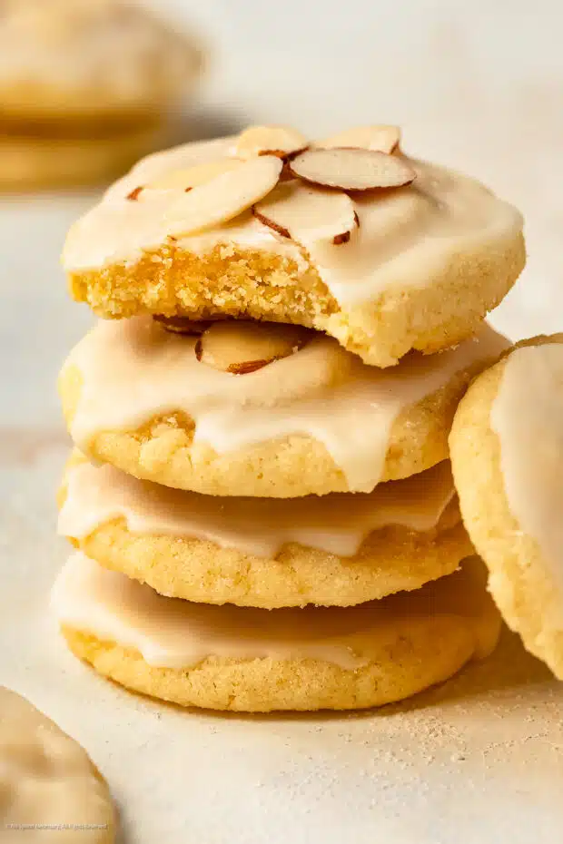 Straight on photo illustrating the soft and chewy texture of sugar cookies with almond. 