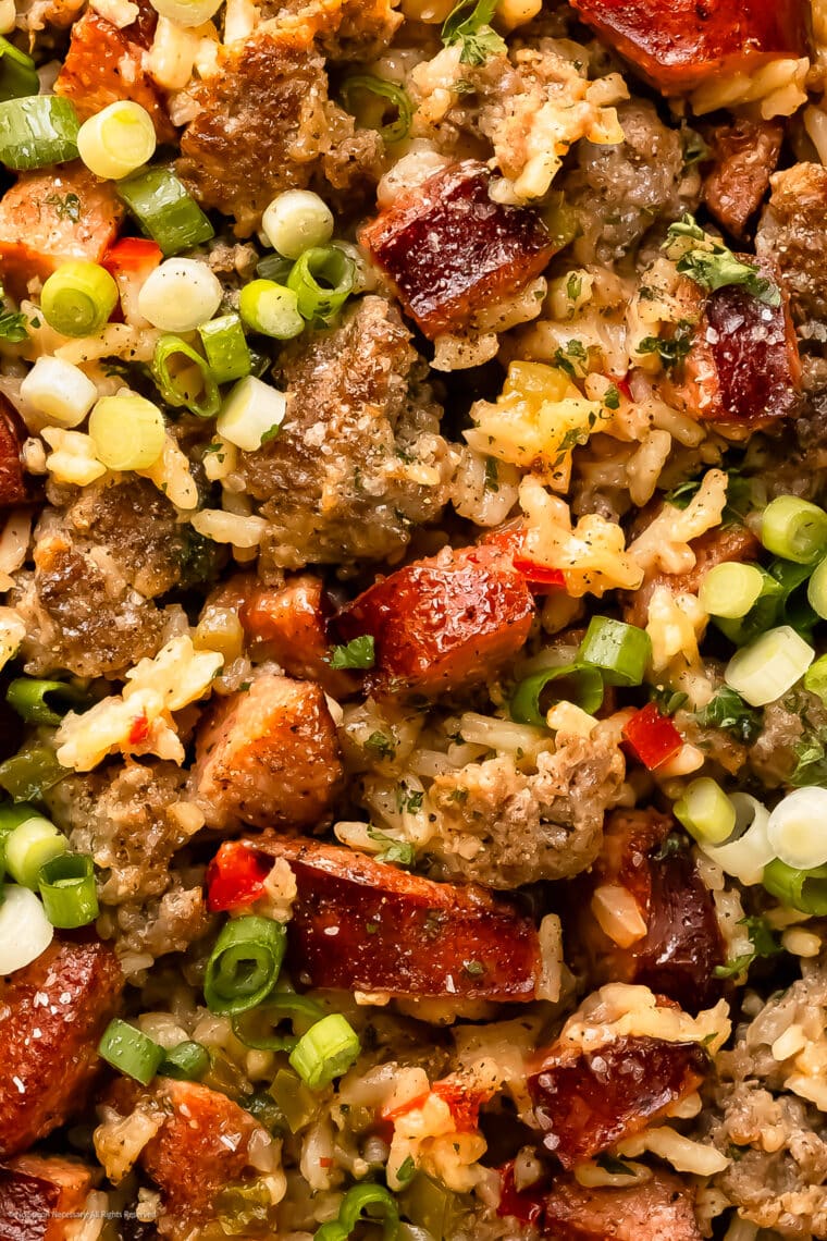 Close-up photo showcasing the hearty texture of dirty rice and beans.