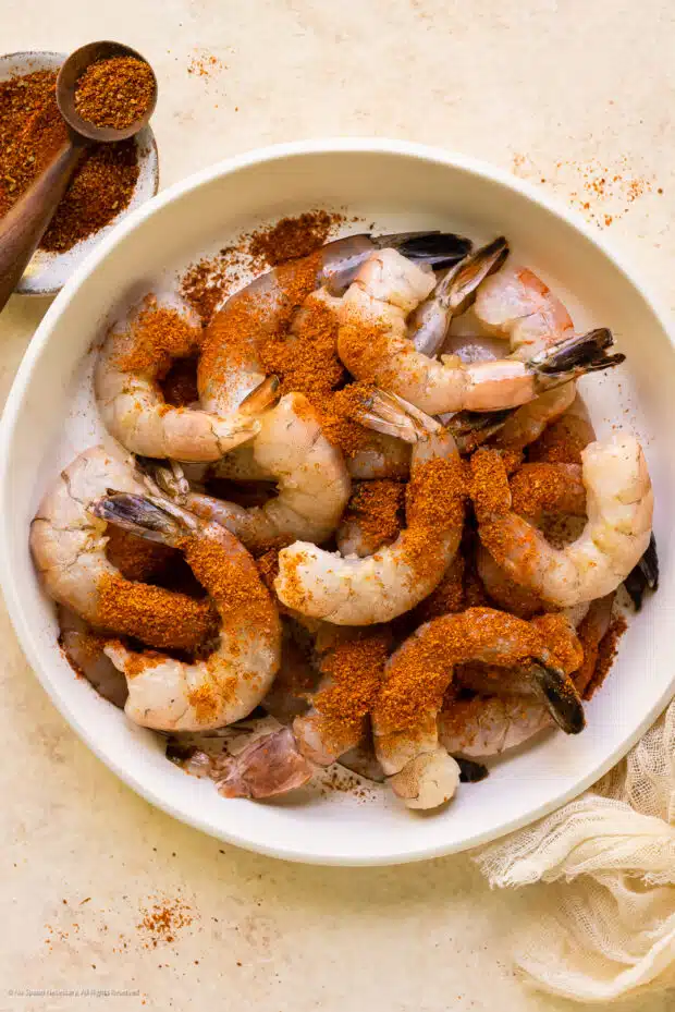 Photo of a bowl of shrimp with homemade old bay seasoning.