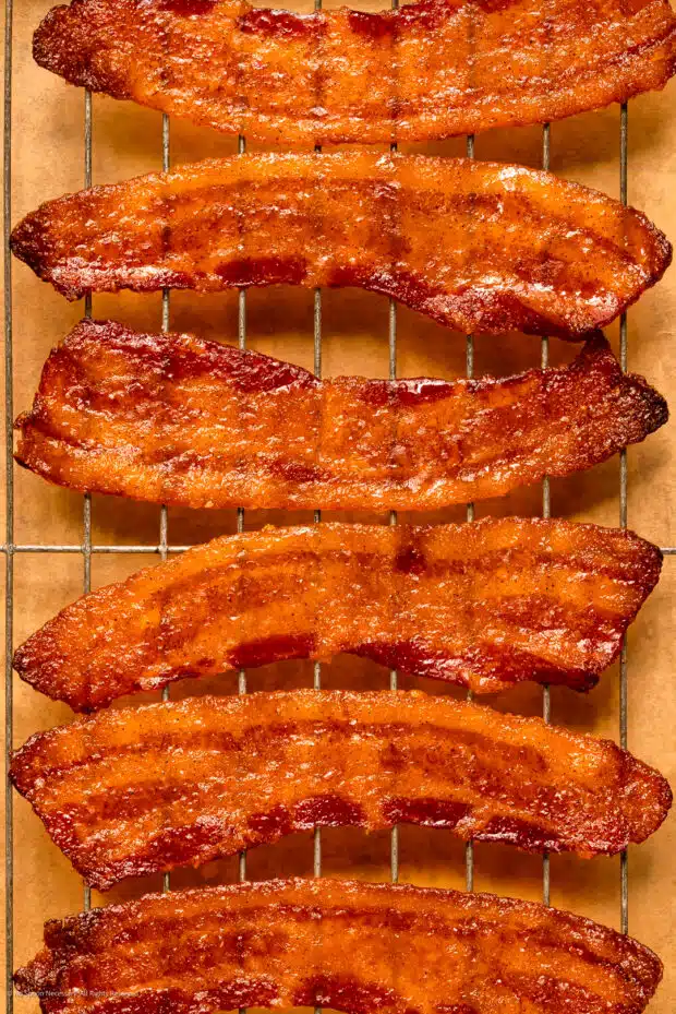 Close-up photo of six slices of maple candy bacon.