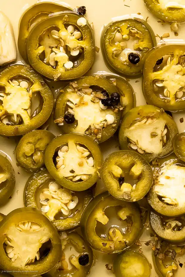 Close-up photo showing the soft texture of a pickled jalapeno pepper.