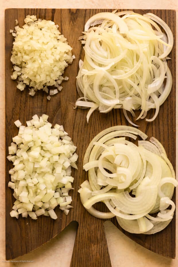 Overhead photo illustrating the different ways to chop an onion - sliced, julienned, diced, and minced.