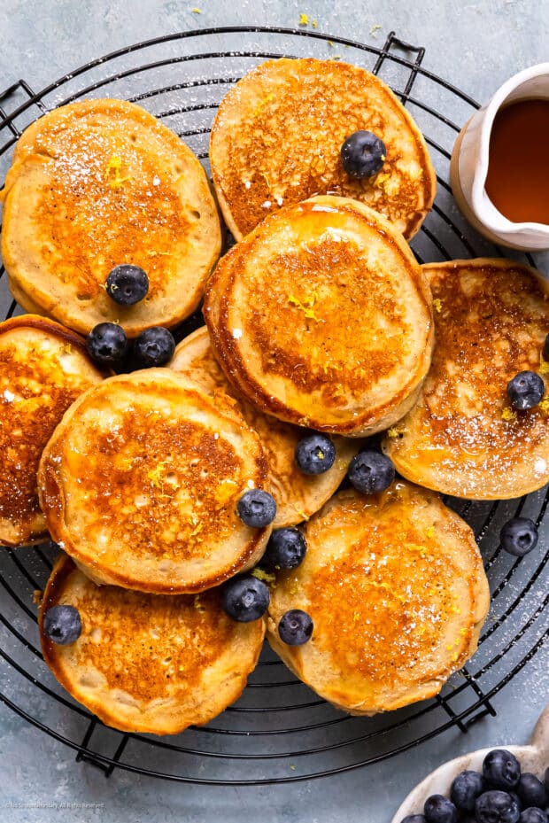Overhead photo of 9 freshly cooked ricotta pancakes.