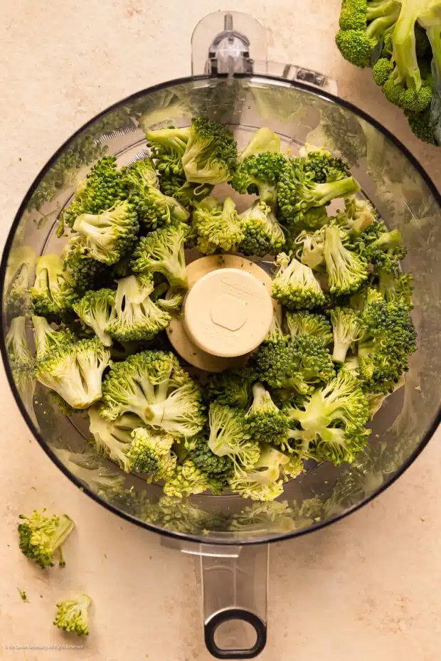 Overhead photo showing how to rice broccoli with a food processor.