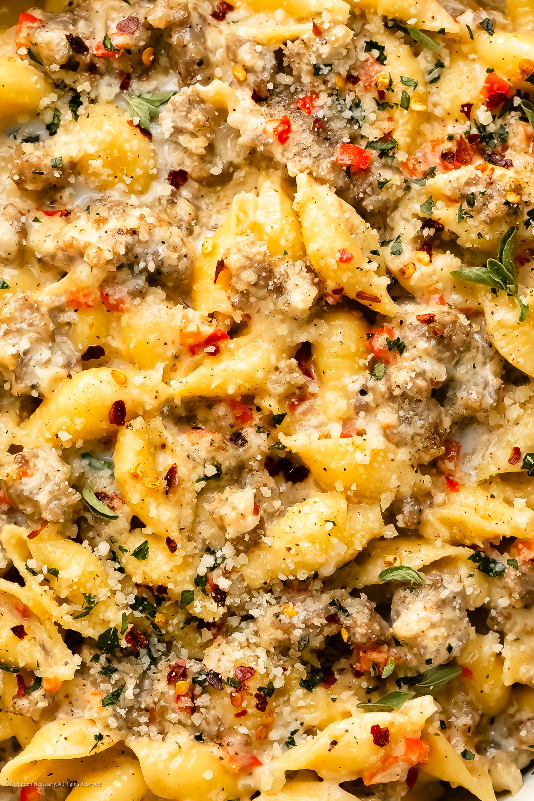 Close-up photo illustrating the rich and creamy texture of sausage pasta cream.