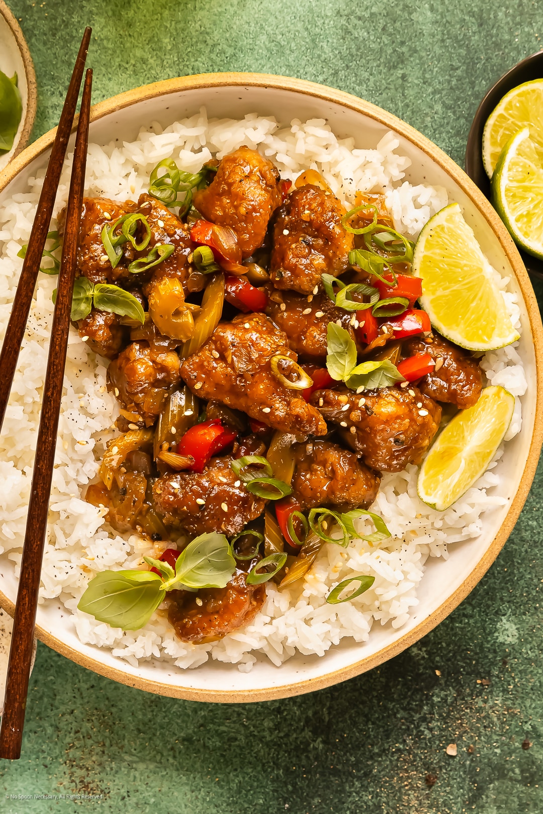Overheat photo of crispy chinese chicken in a black pepper stir fry sauce.